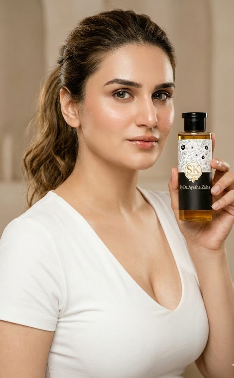 Sk Oil by Dr. Ayesha Zahra, a clear glass bottle with golden oil, shown on a white background with a label featuring the brand and product name.